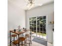 Cozy breakfast nook adjacent to the patio, with natural light and an inviting atmosphere at 2141 Coronado N Pkwy # C, Denver, CO 80229
