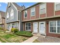 Inviting townhome exterior showcasing neat landscaping and pleasant curb appeal at 1653 S Blackhawk Way # B, Aurora, CO 80012