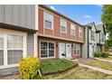 Attractive townhouse featuring a well-kept lawn and colorful exterior at 1653 S Blackhawk Way # B, Aurora, CO 80012