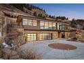 Contemporary home with circular driveway and mountain backdrop at 825 Circle Dr, Boulder, CO 80302