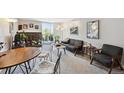 Bright living room featuring a fireplace, sliding doors to a balcony, and comfortable seating at 805 29Th St # 308, Boulder, CO 80303