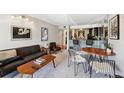 Comfortable living room featuring a bar, table set, and stylish decor at 805 29Th St # 308, Boulder, CO 80303