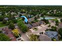 An aerial shot showcasing the property's location in a neighborhood with mature trees and close to a green space at 3142 Captains Ln, Longmont, CO 80503