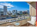 Private balcony overlooking the street, with seating for two at 1216 Perry St, Denver, CO 80204