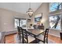 Bright dining room with chandelier and hardwood floors at 4702 S Biscay Ct, Aurora, CO 80015