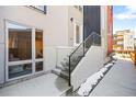 Home exterior features a private entrance, modern design elements, and convenient access to outdoor spaces at 1930 Grove St # 2, Denver, CO 80204