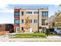 Beautiful multi-story home with a well-manicured lawn, modern architecture, and a charming, welcoming entryway at 1930 Grove St # 2, Denver, CO 80204