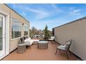 Outdoor living space featuring lounge seating with views on a wood deck at 1930 Grove St # 2, Denver, CO 80204