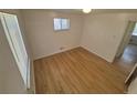 Bedroom featuring hardwood floors and a window at 588 Empire St, Aurora, CO 80010