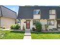 Charming townhouse with a well-manicured lawn and inviting entrance at 6856 S Broadway, Centennial, CO 80122
