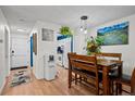 Inviting dining area with bright walls and modern lighting fixtures at 6930 S Broadway, Centennial, CO 80122