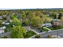 Neighborhood aerial view featuring green landscape and variety of home styles at 6390 W 47Th Ave, Wheat Ridge, CO 80033