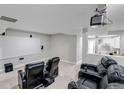 Finished basement featuring a projector screen and tiered seating for the ultimate movie night experience at 3945 John Ave, Castle Rock, CO 80104