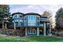 Stunning home with multi-level deck and stone accents at 98 Glenmoor Ln, Cherry Hills Village, CO 80113