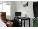 Comfortable bedroom showing work space with monitor and laptop at 1421 N Pearl St # 2, Denver, CO 80203