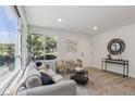 Airy living room is filled with natural light, featuring a sleek sofa and stylish décor for comfortable living at 7970 Chase Cir # 85, Arvada, CO 80003