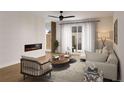 Elegant living room featuring a modern fireplace, hardwood floors, and chic neutral furnishings at 2281 S Sherman St, Denver, CO 80210