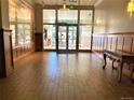 Elegant lobby with wood-paneled walls, tiled floors, and glass doors leading outside at 1555 California St # 302, Denver, CO 80202