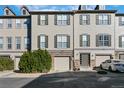 Townhome featuring a neutral exterior, attached garage, and well-maintained landscaping at 909 Burning Bush Pt, Monument, CO 80132