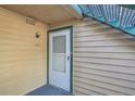 Close-up of the front door with the unit number and a secure entryway at 15136 E Louisiana Dr # 106, Aurora, CO 80012