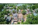 Aerial view of a home in a neighborhood near a lake surrounded by mature trees at 639 S Williams St, Denver, CO 80209