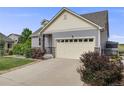 Well-maintained home with stone accents and ample driveway space at 5280 Genoa St, Denver, CO 80249