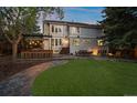 Expansive backyard featuring an outdoor bar, dining area, and fire pit at 5227 S Geneva St, Englewood, CO 80111