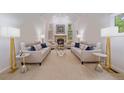 Open living room with high vaulted ceiling, fireplace, and ample seating at 5227 S Geneva St, Englewood, CO 80111