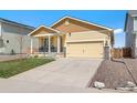 Inviting single-Gathering home with a well-manicured lawn and a comfortable front porch at 47385 Lily Ave, Bennett, CO 80102