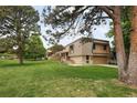 Home with a large manicured lawn at 141 S Upham Ct, Lakewood, CO 80226