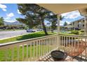 Balcony view showcasing patio furniture and the surrounding complex amenities, including a pool at 645 Manhattan Pl # 106, Boulder, CO 80303