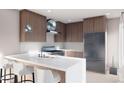 Contemporary kitchen with breakfast bar, stainless steel appliances, pendant lighting, and modern cabinetry at 3728 W 1St Ave, Denver, CO 80219