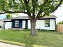 Charming single Gathering home boasts a well manicured front yard and an attached garage at 4312 S Xenon St, Morrison, CO 80465