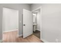 Modern half bathroom with a pedestal sink and stylish hexagon tile flooring at 14265 Currant St, Broomfield, CO 80020