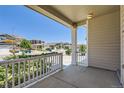Inviting front porch offering a peaceful view of the neighborhood and a cozy place to relax at 7933 Florado St, Denver, CO 80221