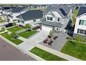 An aerial view of a beautifully landscaped home in a well-planned community at 7166 S Vandriver Way, Aurora, CO 80016