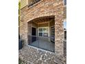 Covered patio with stone archway and wrought iron railing at 17346 Nature Walk Trail Trl # 105, Parker, CO 80134