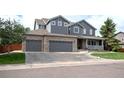 Attractive two-story house with a three-car garage and a welcoming front porch at 14962 Williams St, Thornton, CO 80602
