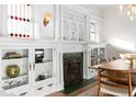 Elegant dining room featuring a built-in hutch and fireplace at 2550 W 43Rd Ave, Denver, CO 80211