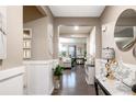 Warm and inviting foyer with hardwood floors, neutral walls, and stylish decor at 6922 Vermillion St, Frederick, CO 80530