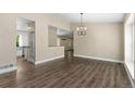 Open living area boasting hardwood floors, neutral walls, and a seamless transition to the kitchen at 142 S Fillmore Ave, Louisville, CO 80027