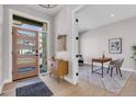 Spacious foyer featuring a modern cabinet, front door, and adjacent office space at 936 Sunflower St, Louisville, CO 80027