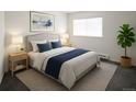 Relaxing bedroom with a large window, comfortable bed, and tasteful decor at 14500 E 2Nd Ave # 209A, Aurora, CO 80011
