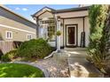 Inviting front porch with decorative landscaping and a welcoming entrance sign for a touch of curb appeal at 7345 W 97Th Pl, Broomfield, CO 80021