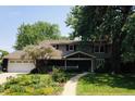 Charming home with lush landscaping and a beautiful front yard at 2134 S Jackson St, Denver, CO 80210