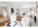 Living room with fireplace, hardwood flooring, and natural light at 2134 S Jackson St, Denver, CO 80210