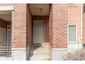 Charming brick front entrance with a welcoming doorway and unit number at 4100 Albion St # 205, Denver, CO 80216