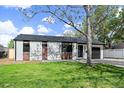 Charming single-story home with a well-maintained front yard and a private driveway to a one car garage at 1360 S Forest Way, Denver, CO 80222