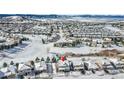 Aerial view of a house in a snow-covered neighborhood at 2229 Candleglow St, Castle Rock, CO 80109