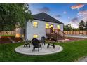 Landscaped backyard with a firepit and seating area at 3360 Broadway St, Boulder, CO 80304